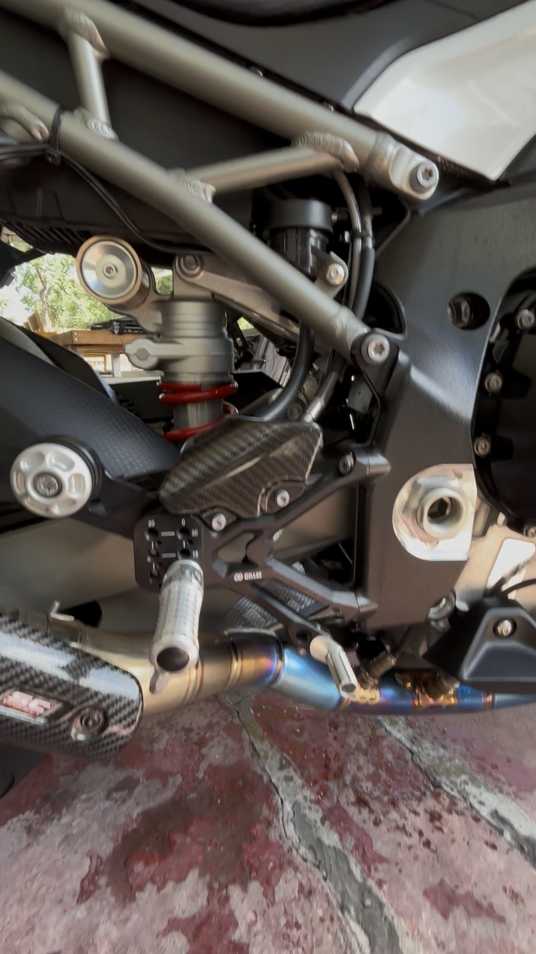 BMW S1000RR rearset and exhaust close-up
