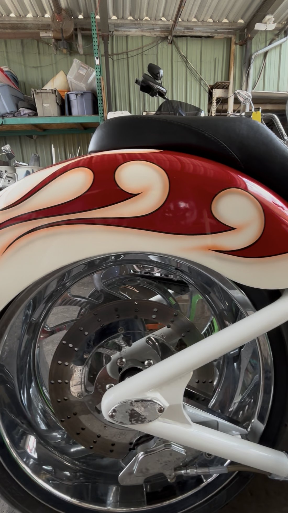 Custom Harley rear fender flame paint and chrome wheel