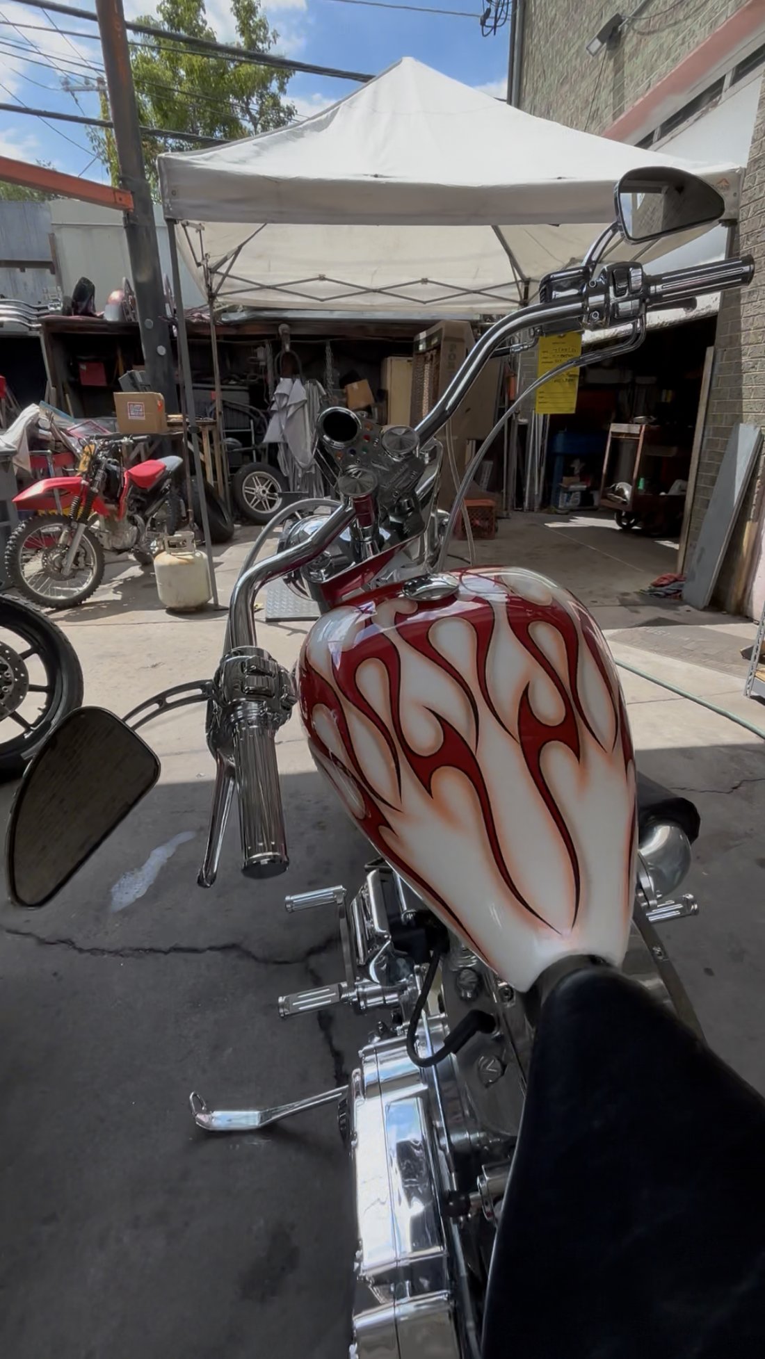 Custom Harley tank flame paint and handlebars