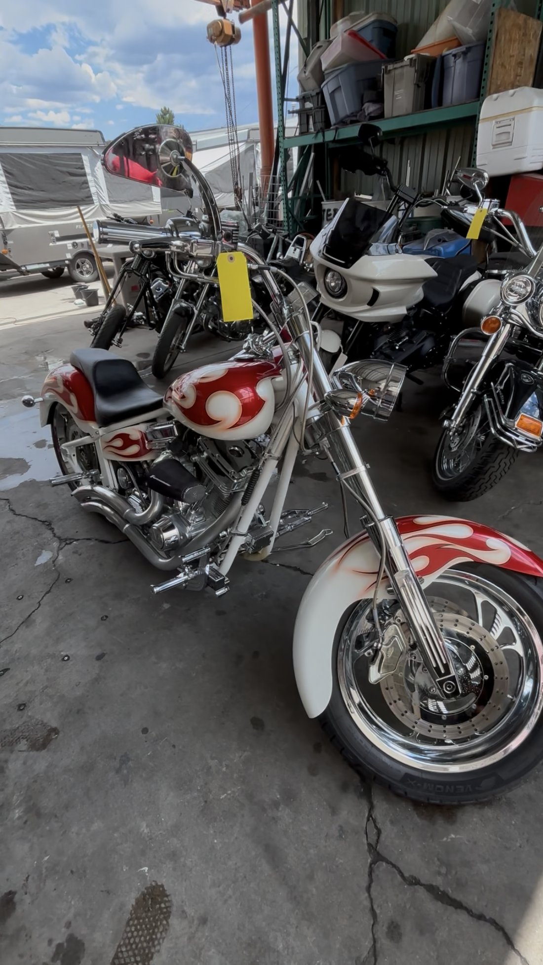 Custom Harley white and red flame paint front three-quarter