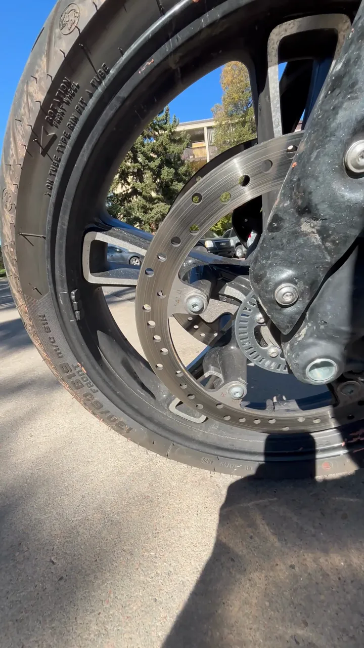 Indian motorcycle front wheel and brake after full detail, paint correction and ceramic coating